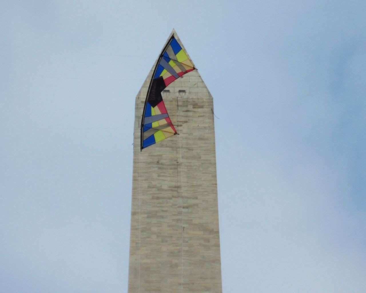 A kite flying over a monument