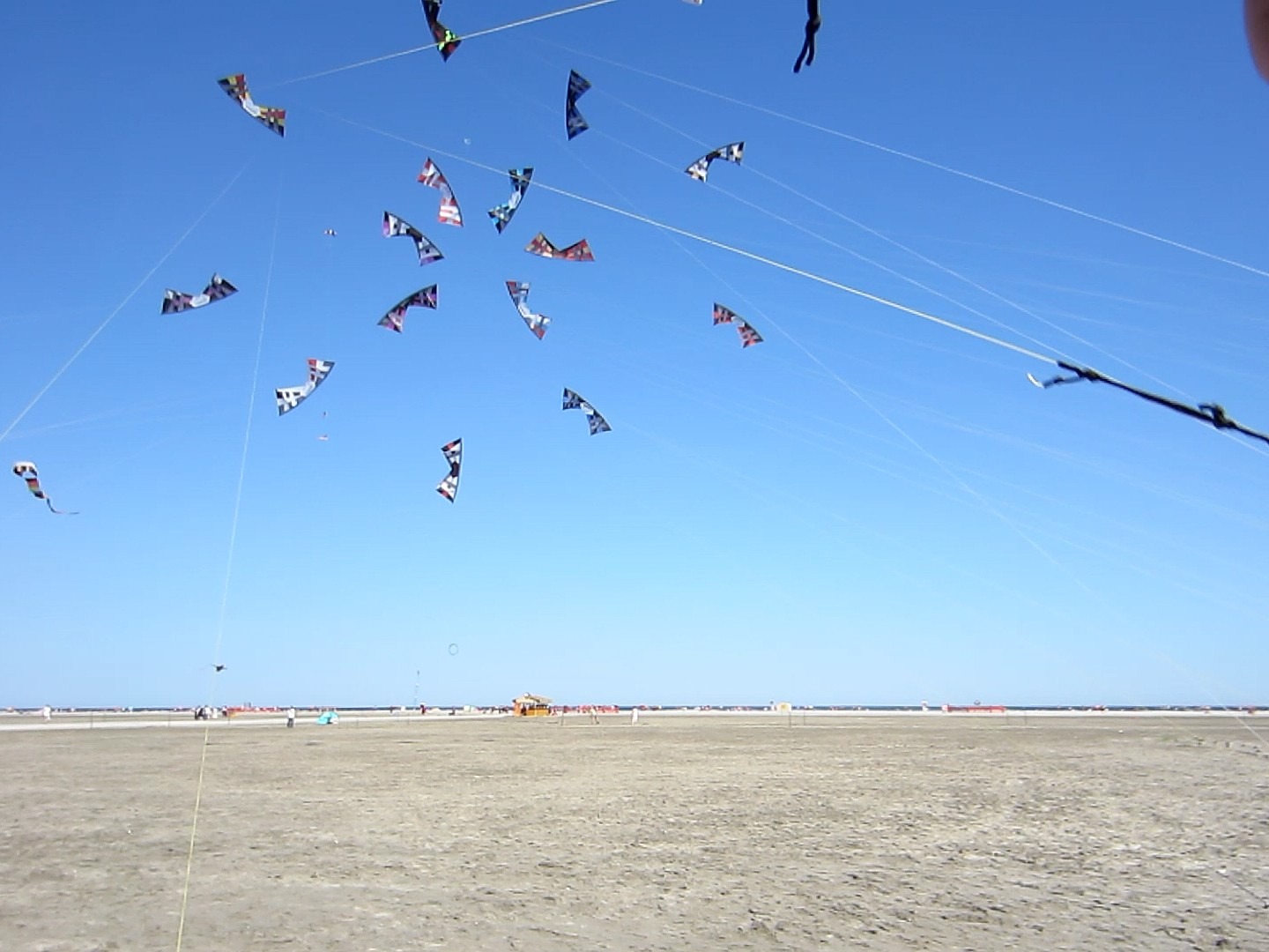 A blue sky with flying kites